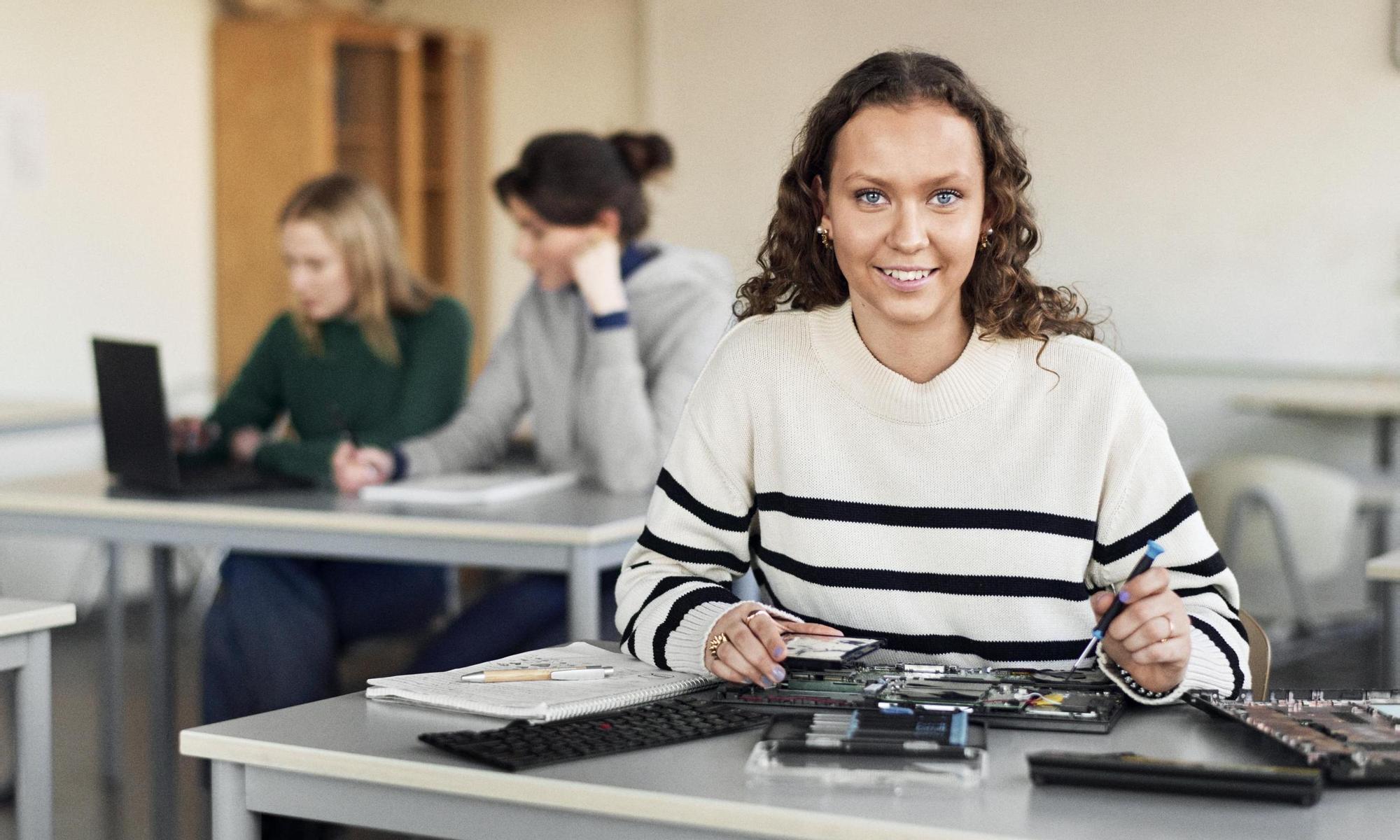 Student in a classroom having a technology lesson