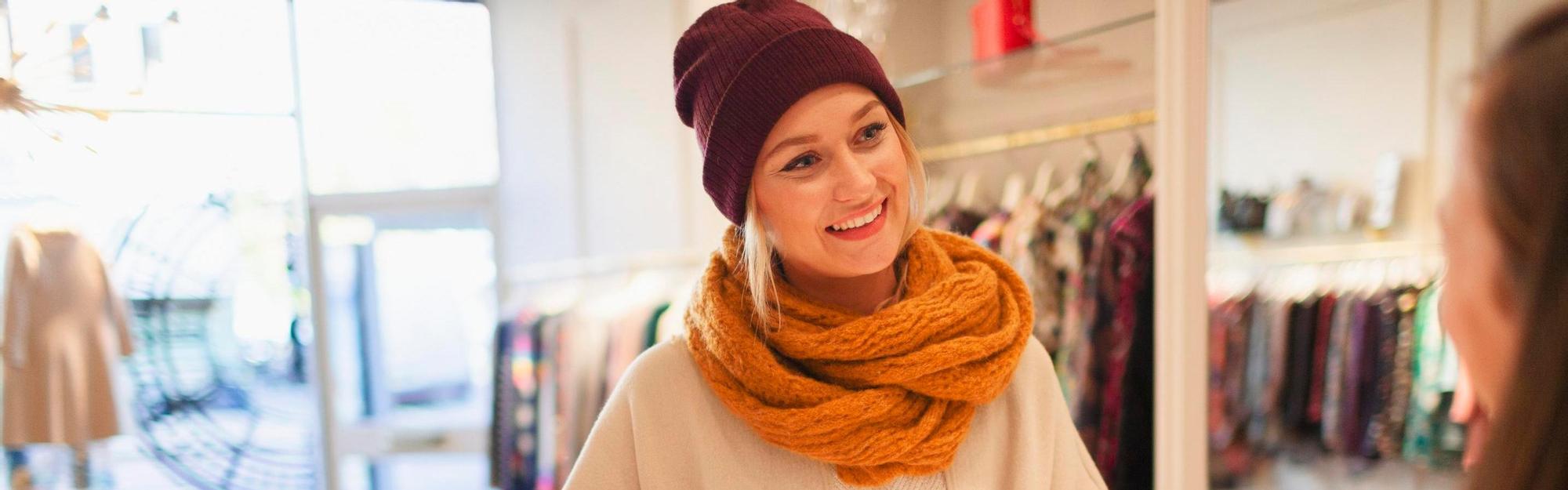 Young woman shopping in the store with her credit card