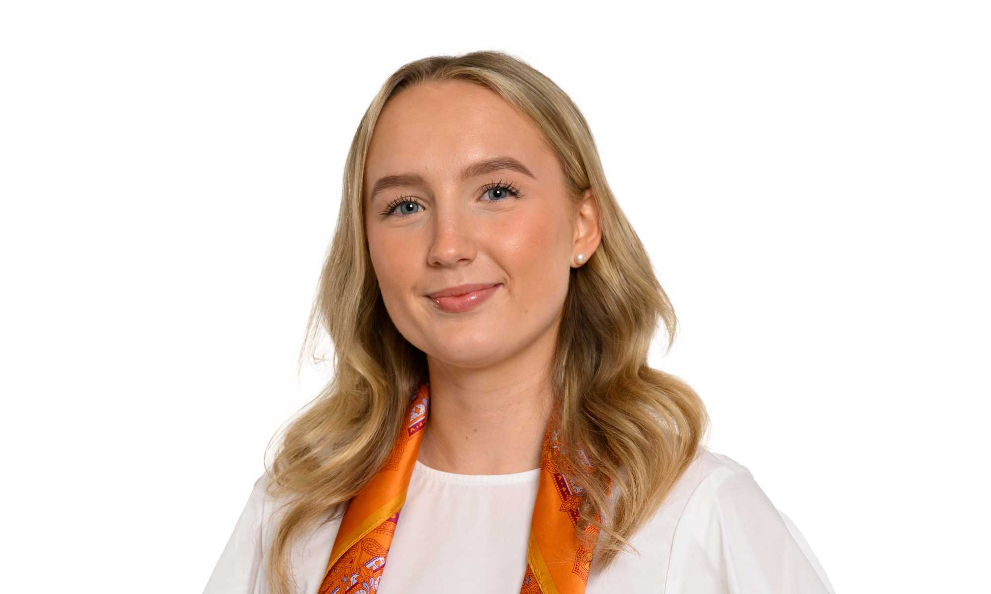 a woman in a white shirt and orange scarf