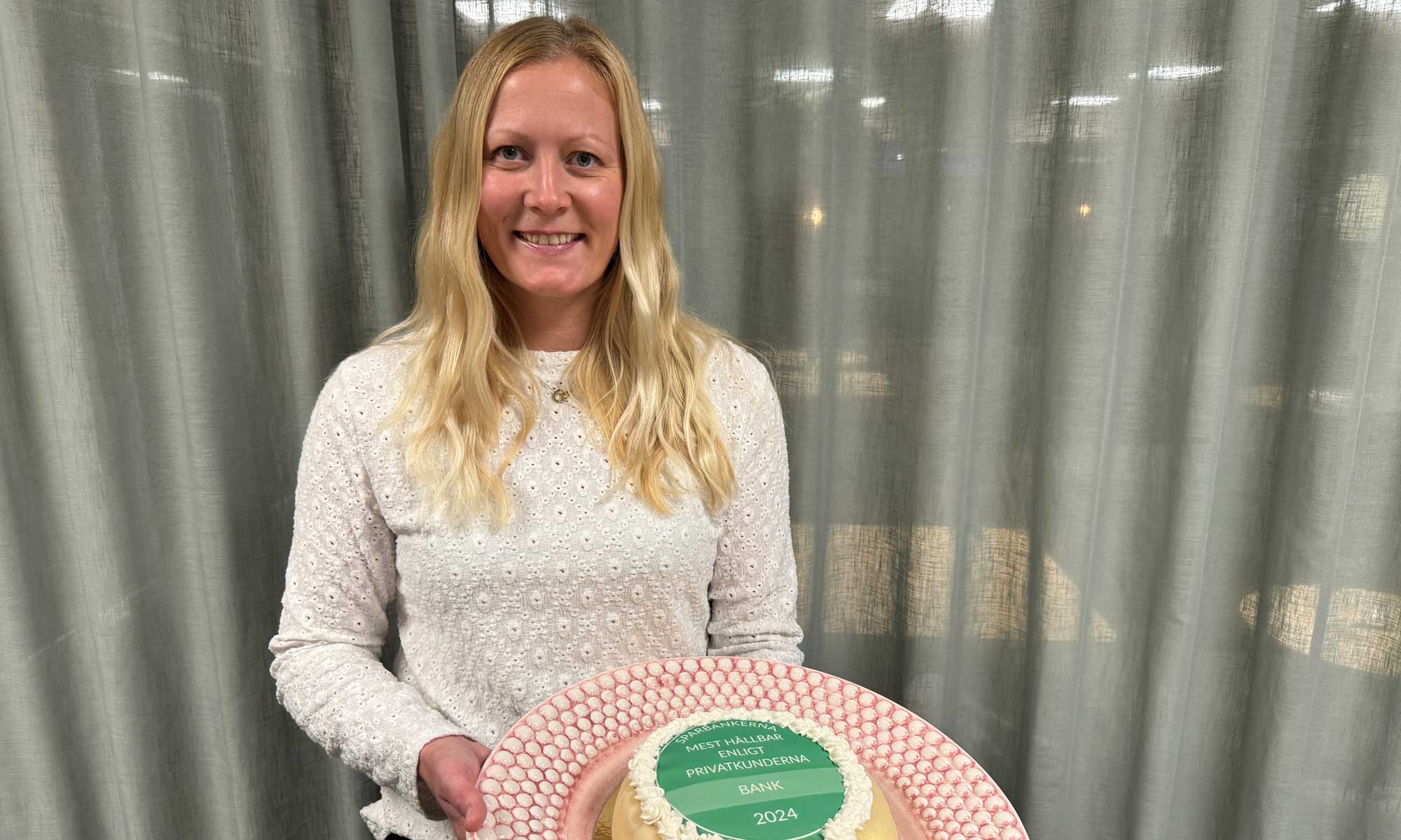 women holding a cake