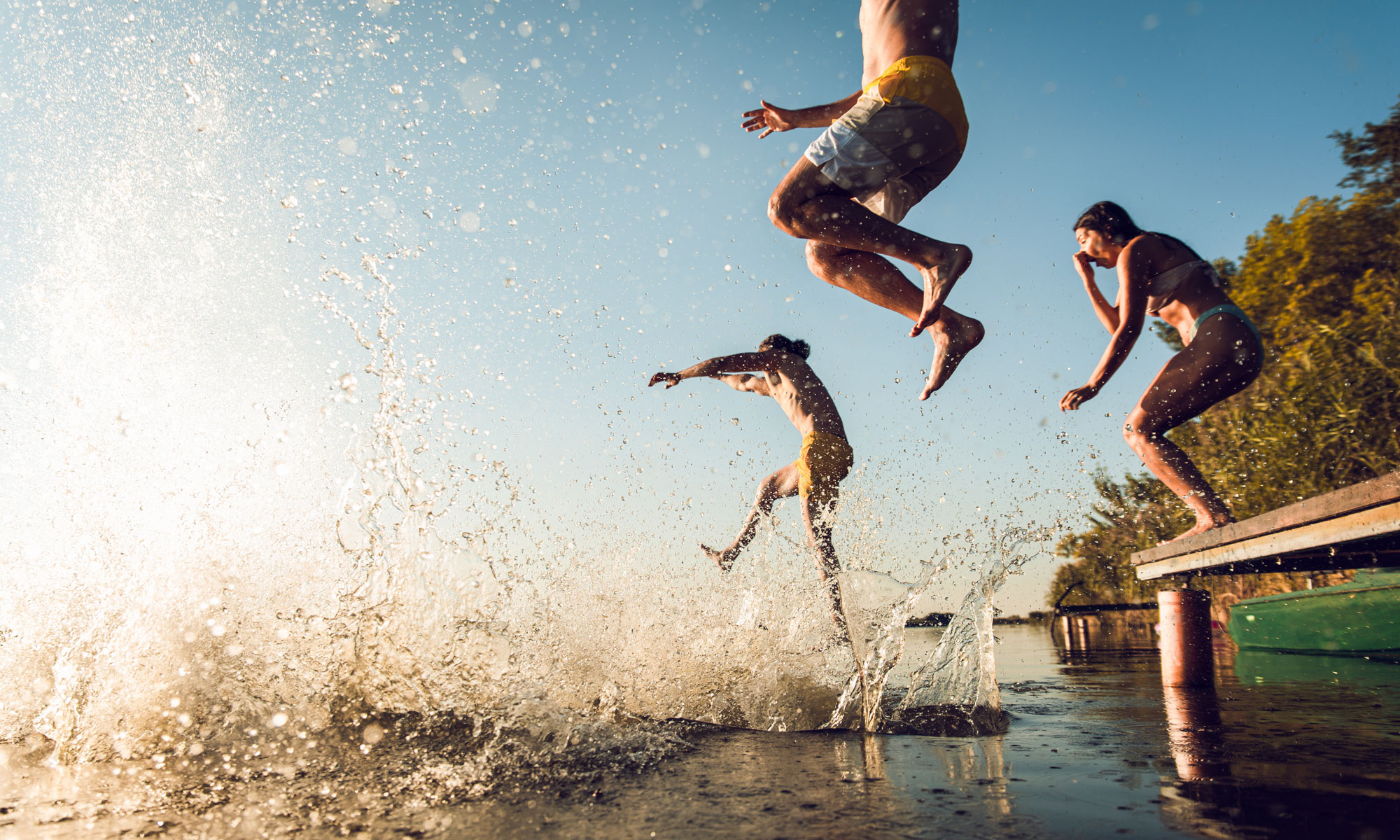 bathing children jumping into the water