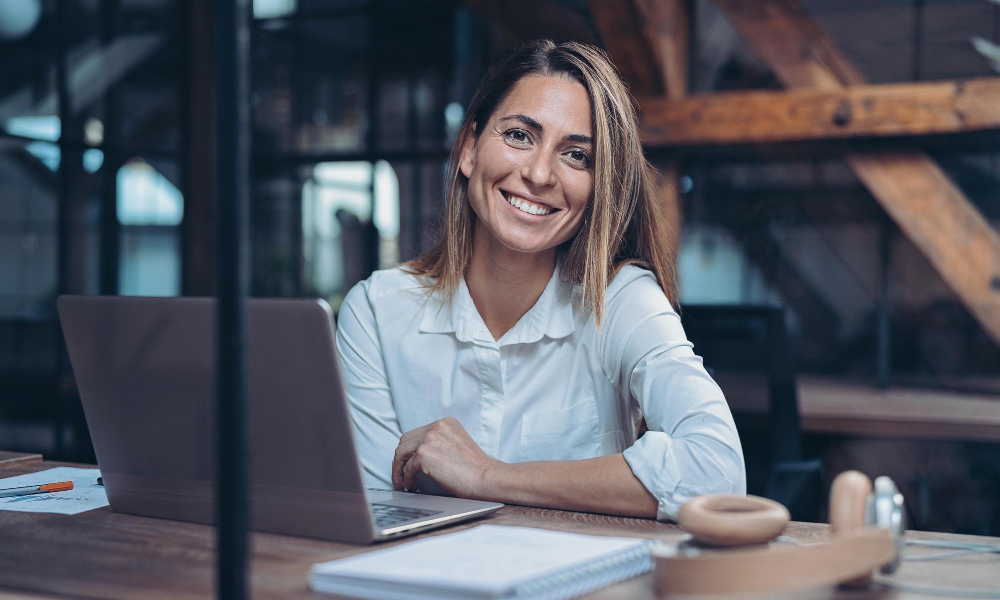 Woman in office sitting in front of computer